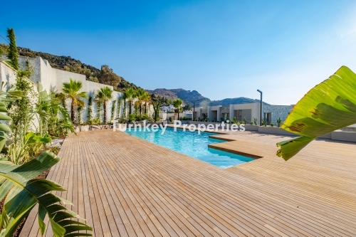 3+1 Apartment for Sale with Marina and Kaliminos Views in Turgutreis | Shared Pool, Underfloor Heating, Generator, and Water Tank Features